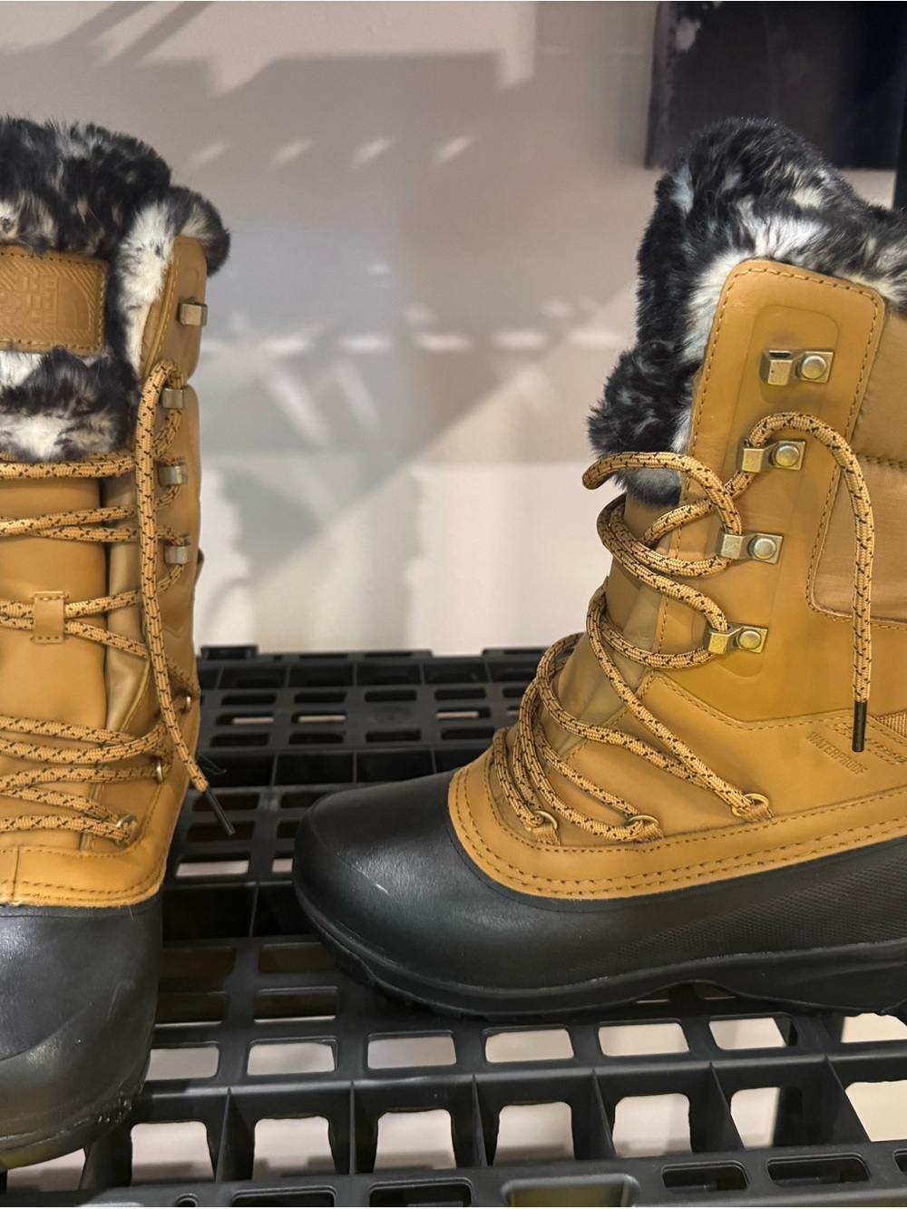 The North Face Tan and Black Insulated Winter Boot with Faux Fur Cuff